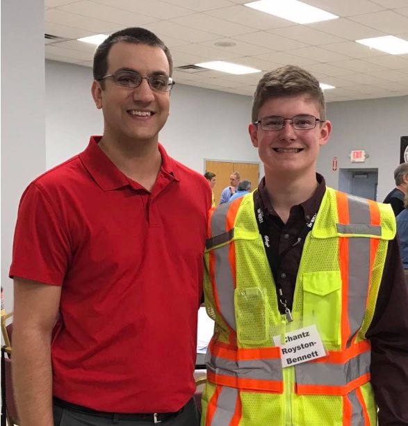 Chantz and Donny pose for a photo in his uniform.